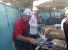 Lion Grahame Chenery and Lion Richard Collins cooking burgers and sausages
